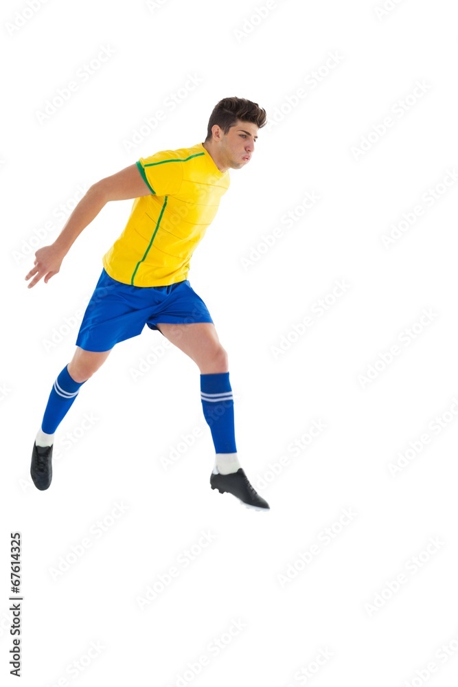Football player in yellow jumping