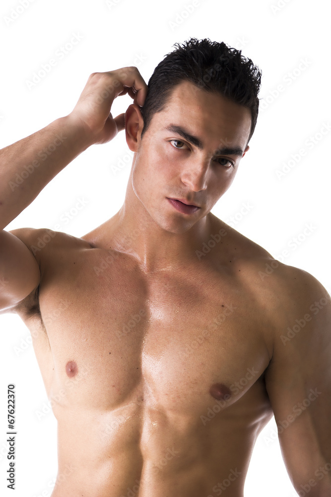 Fototapeta premium Muscular young man unsure or confused, scratching head
