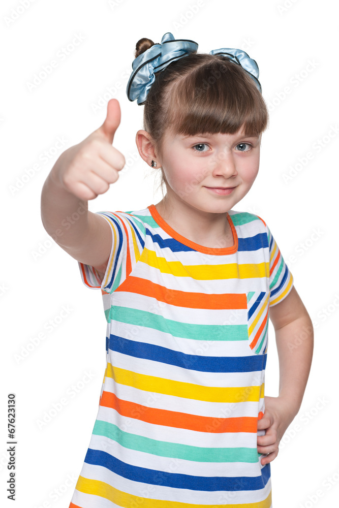 Adorable little girl holds her thumbs up Adorable little girl holds her thumbs up