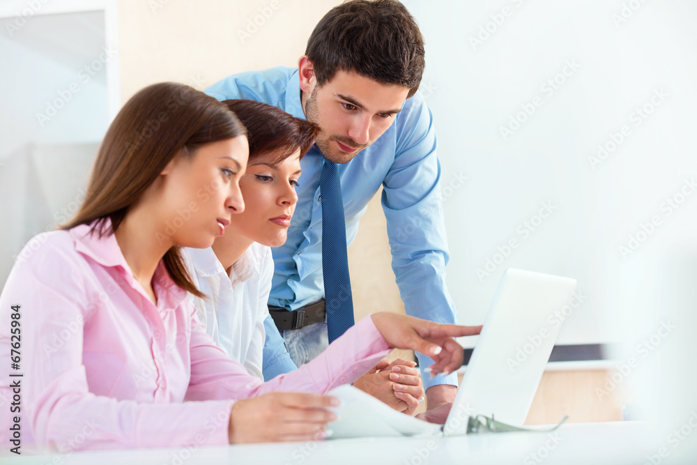 Business people meeting in office to discuss project Business people meeting in office to discuss project