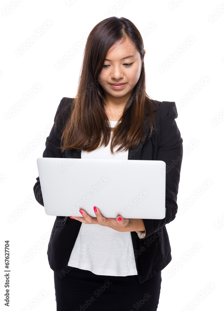Business woman look at laptop computer Business woman look at laptop computer