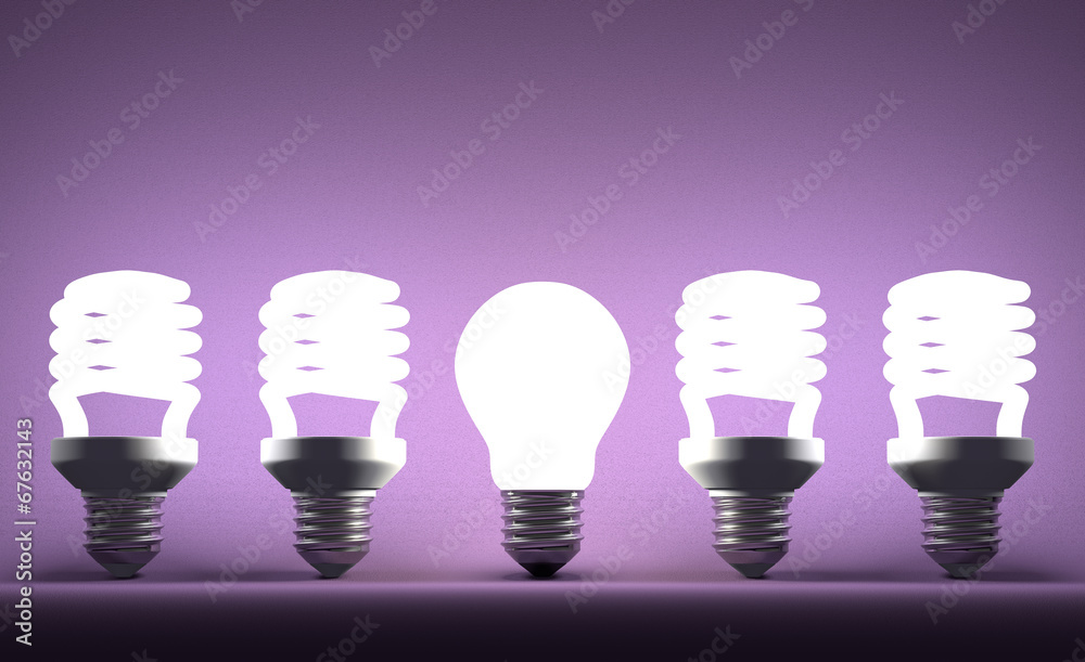 Glowing tungsten light bulb in row of spiral ones Glowing tungsten light bulb in row of spiral ones