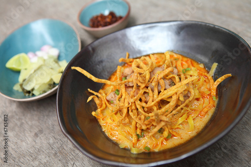 Noodle Khao soi , Thai food on wood background