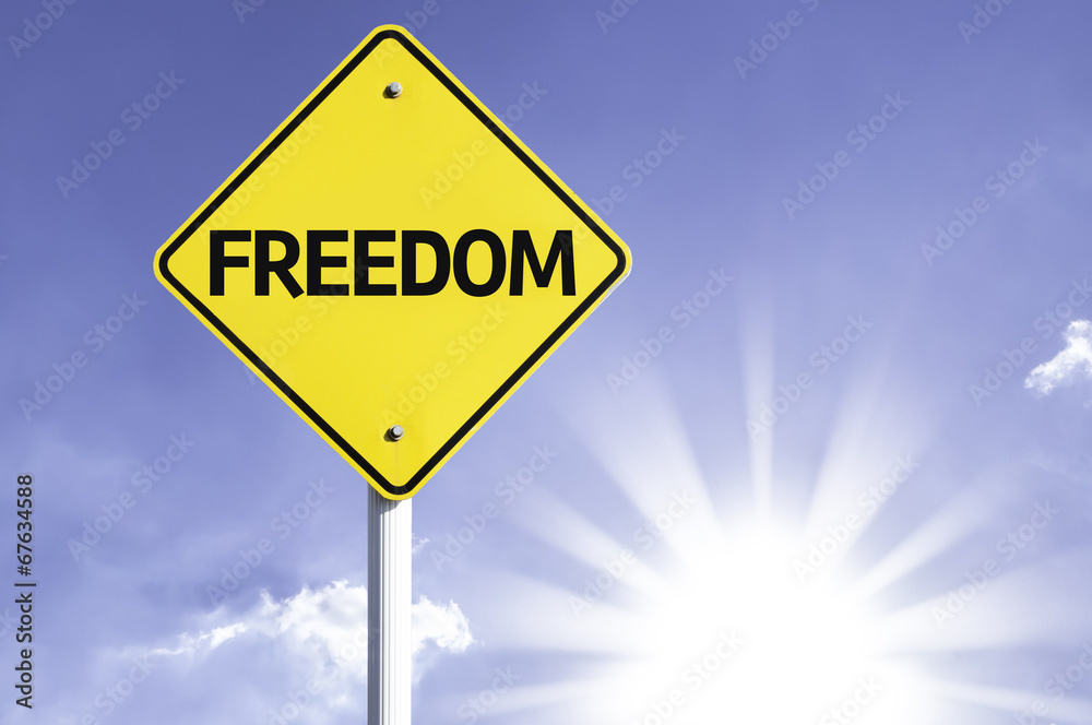 Freedom road sign with sun background Freedom road sign with sun background