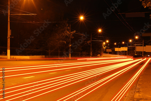 Moving car with blur light through city at night