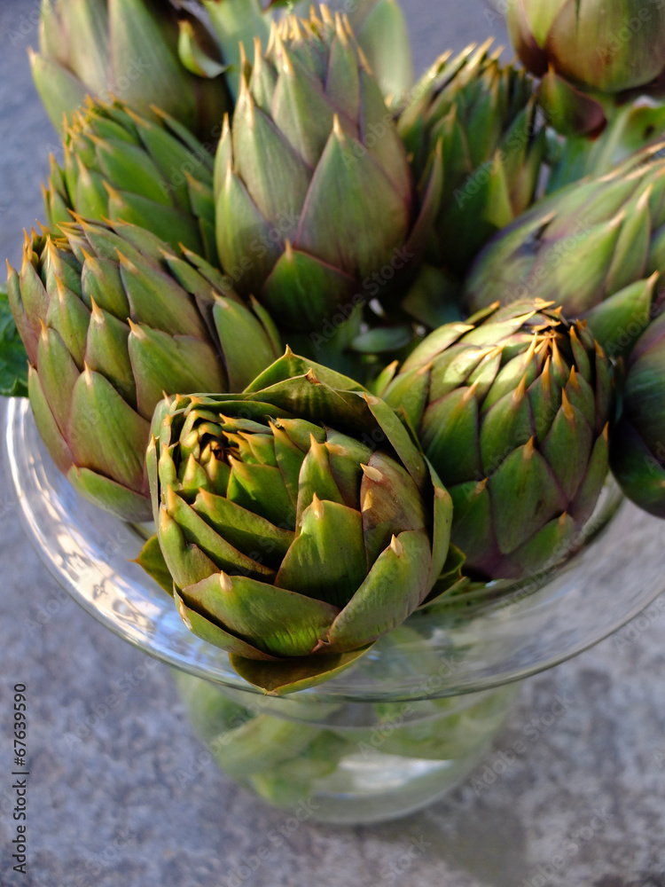 Fototapeta premium Artichokes in a glass pot