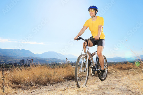 Fototapeta Naklejka Na Ścianę i Meble -  Biiker riding mountain bike