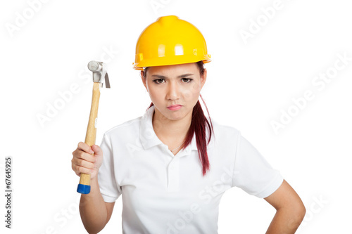 Angry Asian engineer girl hold a hammer