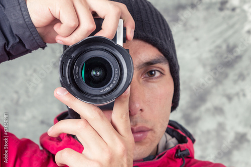 closeup of young handsome man wearing red jacket and black photo