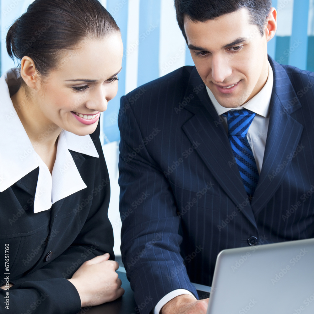 Businesspeople working with laptop at office Businesspeople working with laptop at office