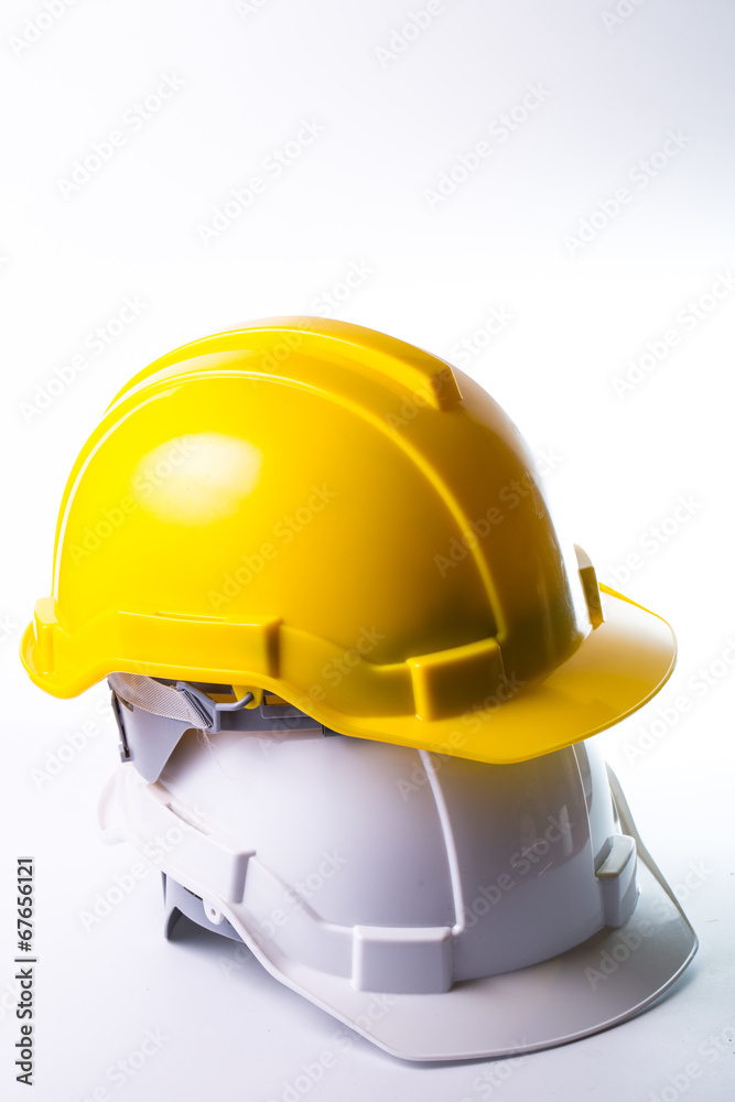 Fototapeta premium Safety hat isolated with alram clock