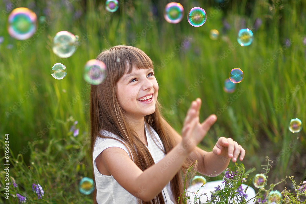 portrait of little girl outdoors in summer