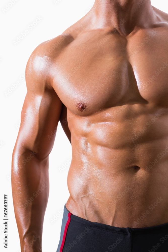 Mid section of shirtless muscular man