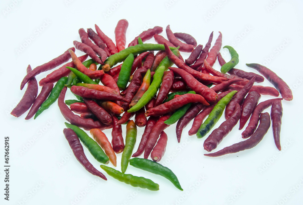 Red and green chilli peppers on white background Red and green chilli peppers on white background