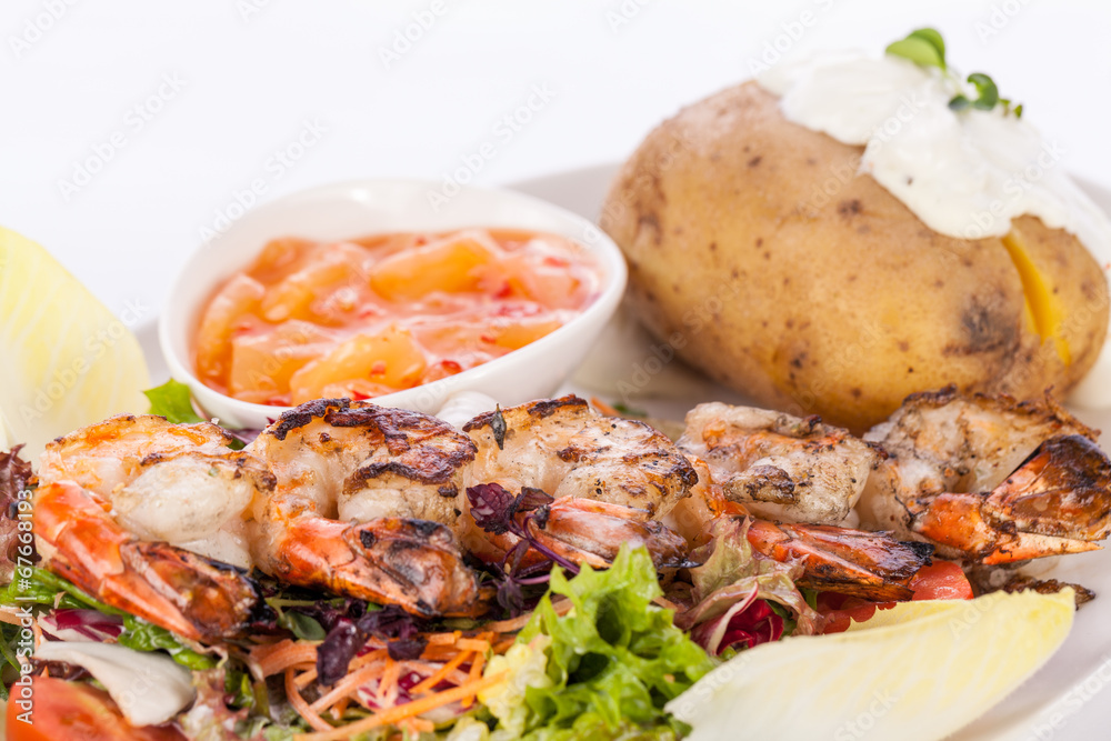 Grilled prawns with endive salad and jacket potato Grilled prawns with endive salad and jacket potato