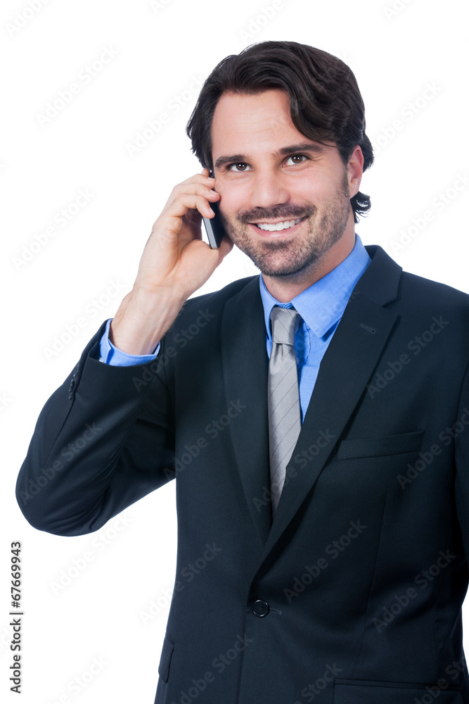 Stylish businessman talking on his mobile phone Stylish businessman talking on his mobile phone