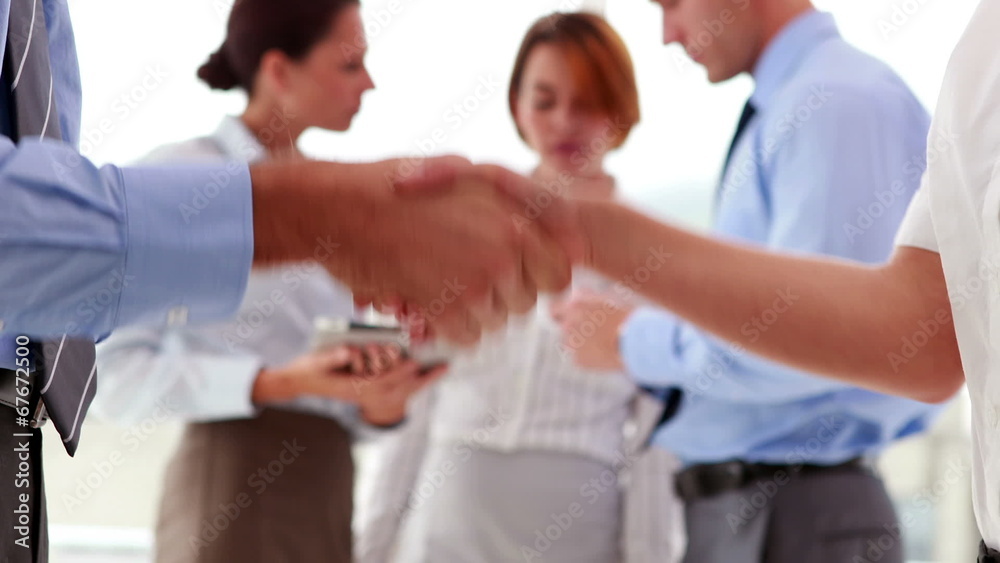 Business people shaking their hands Business people shaking their hands