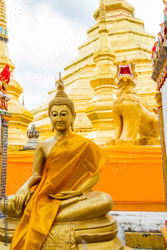 Ancient pagoda with buddha statue of Phra Borom Thad Bantak temp photo