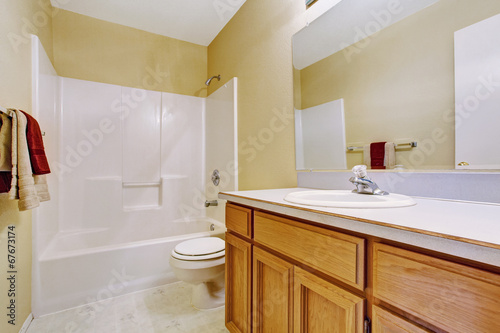 Empty bathroom interior in soft ivory