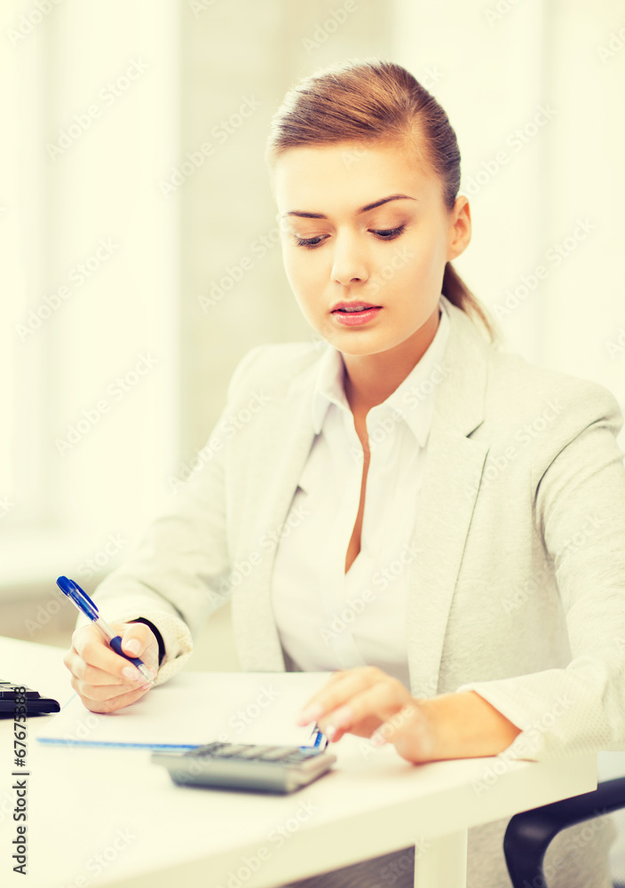 businesswoman with notebook and calculator businesswoman with notebook and calculator