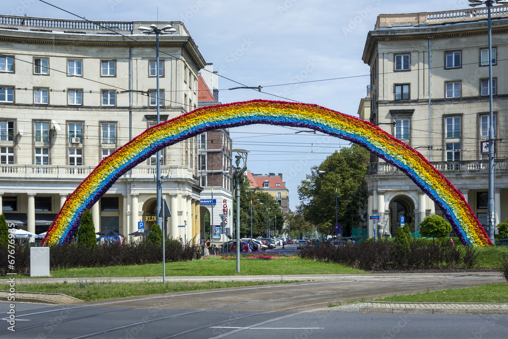 Naklejka premium An artistic construction of rainbow on Savior Square in Warsaw