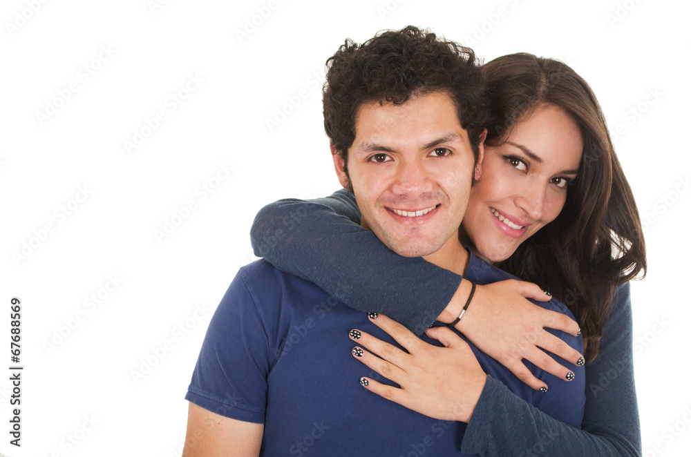 hispanic young couple hugging hispanic young couple hugging
