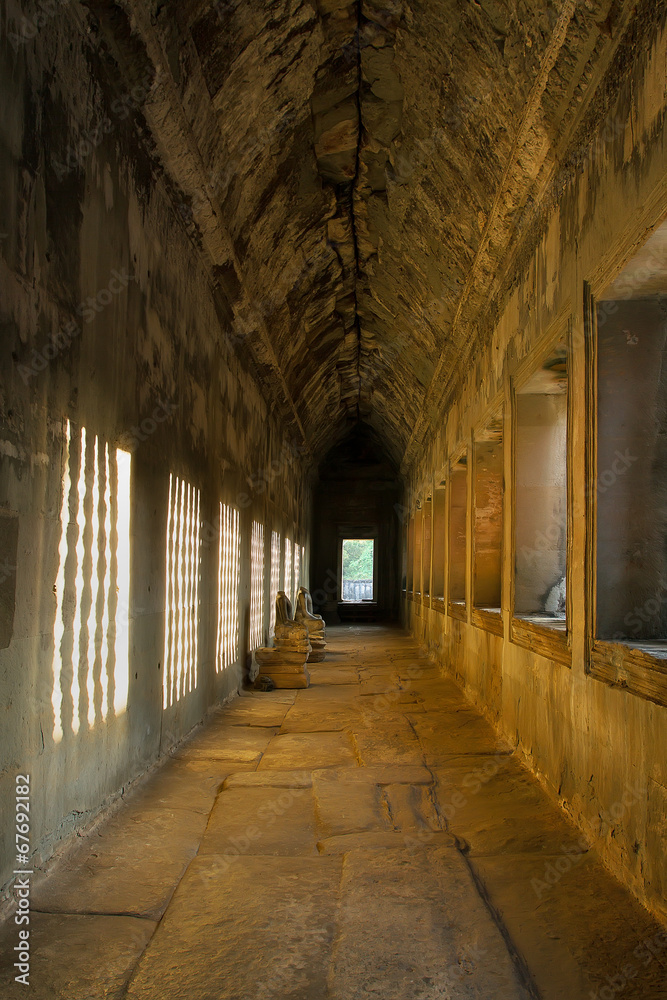 Angkor wat: Sunlight through the window effected on the wall Angkor wat: Sunlight through the window effected on the wall
