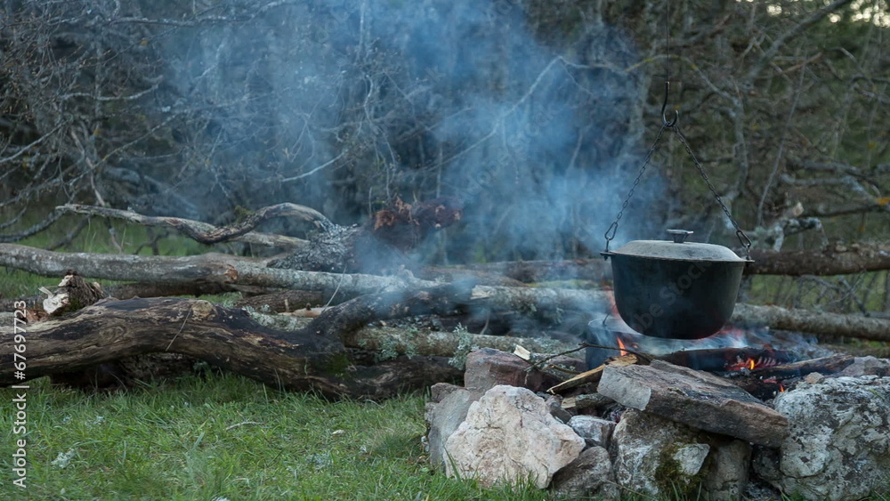 Tourist campfire. Preparing food Tourist campfire. Preparing food