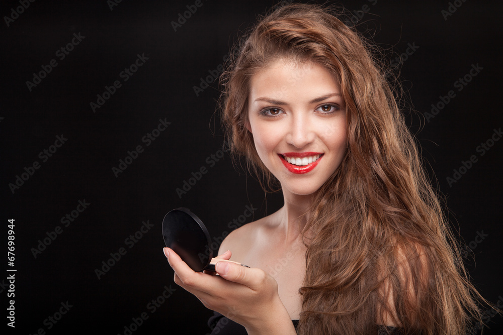 Portrait of beautiful young woman with lipstick and mirror Portrait of beautiful young woman with lipstick and mirror