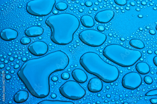 Water drops on a blue surface photo