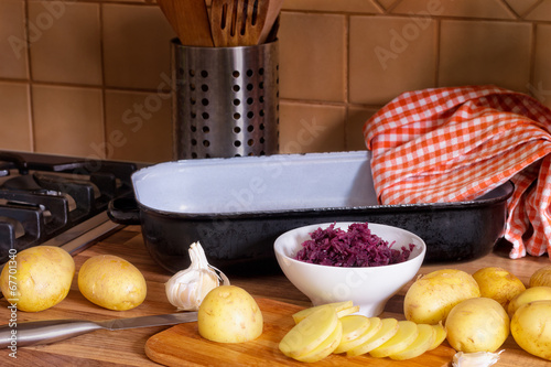 New potatoes, a bowl of pickled cabbage and garlic.