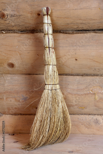 broom in a log house