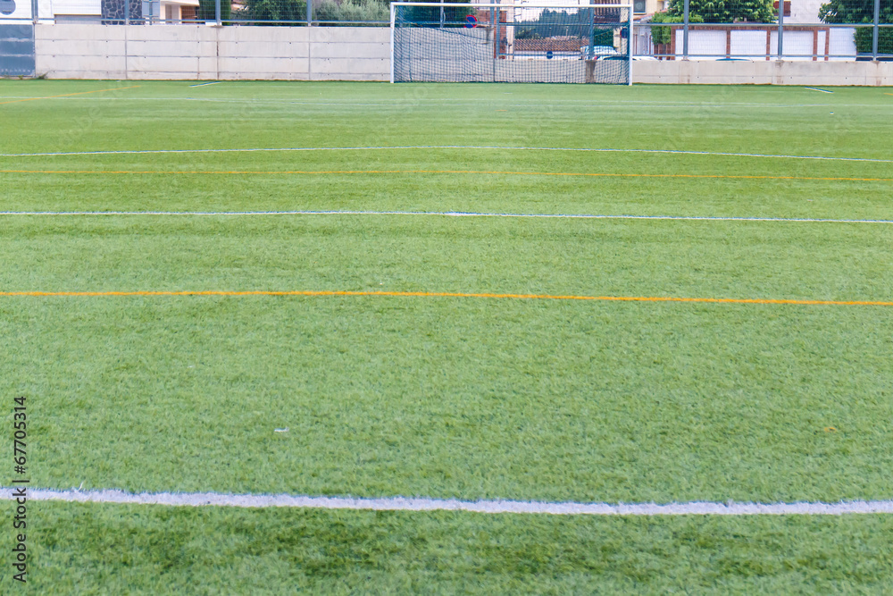 Obraz premium football amateur stadium with green grass