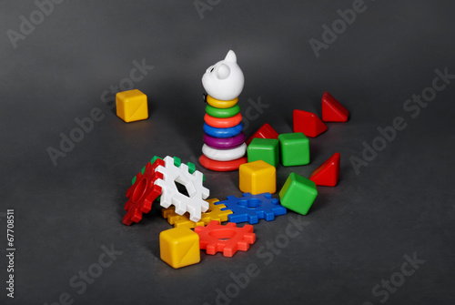 Scattered colorful plastic toys left by children