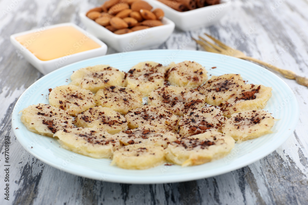 Sweetened fried banana on plate, close-up Sweetened fried banana on plate, close-up