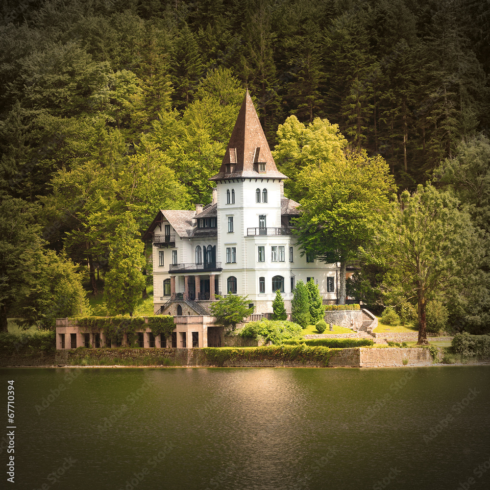 The Grundlsee lake coast with beautiful castle. Austria, Europe.