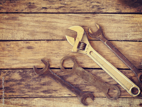 wrench on wood old retro vintage style photo
