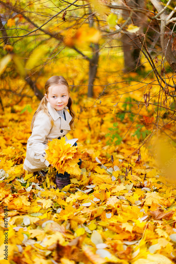 Little girl outdoors on autumn day Little girl outdoors on autumn day