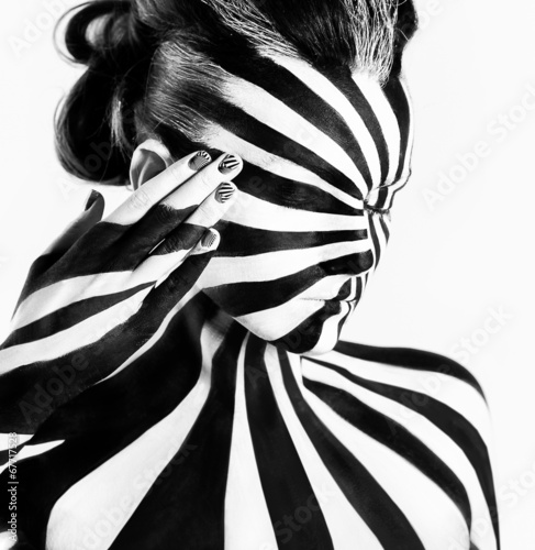 Spiral bodyart on the body of a young girl