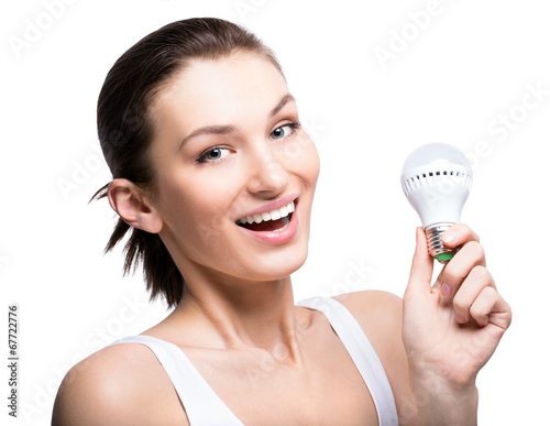 Happy woman with a LED lightbulb