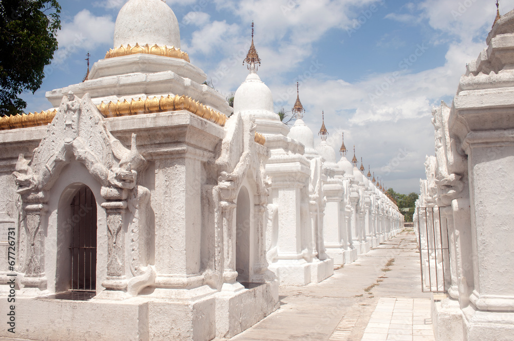 Row of white pagodas in Kuthodaw temple, Myanmar. Row of white pagodas in Kuthodaw temple, Myanmar.