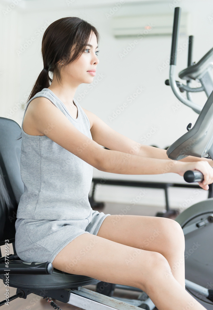 Fototapeta premium Woman workout at fitness