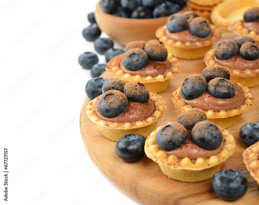 Tartlets with chocolate cream and blueberries