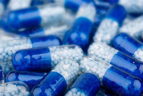 Blue capsules (pills) background