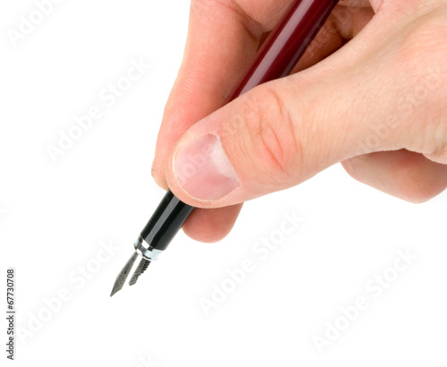 Hand holding a pen  writing or signing  isolated