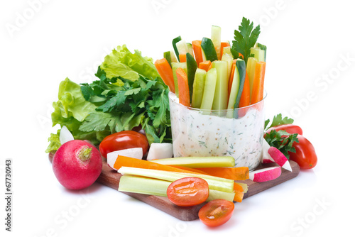 snacks - vegetables with yogurt sauce in a glass and fresh herbs
