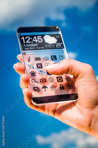 Wallpaper Mural Smartphone with transparent screen in human hands. Torontodigital.ca