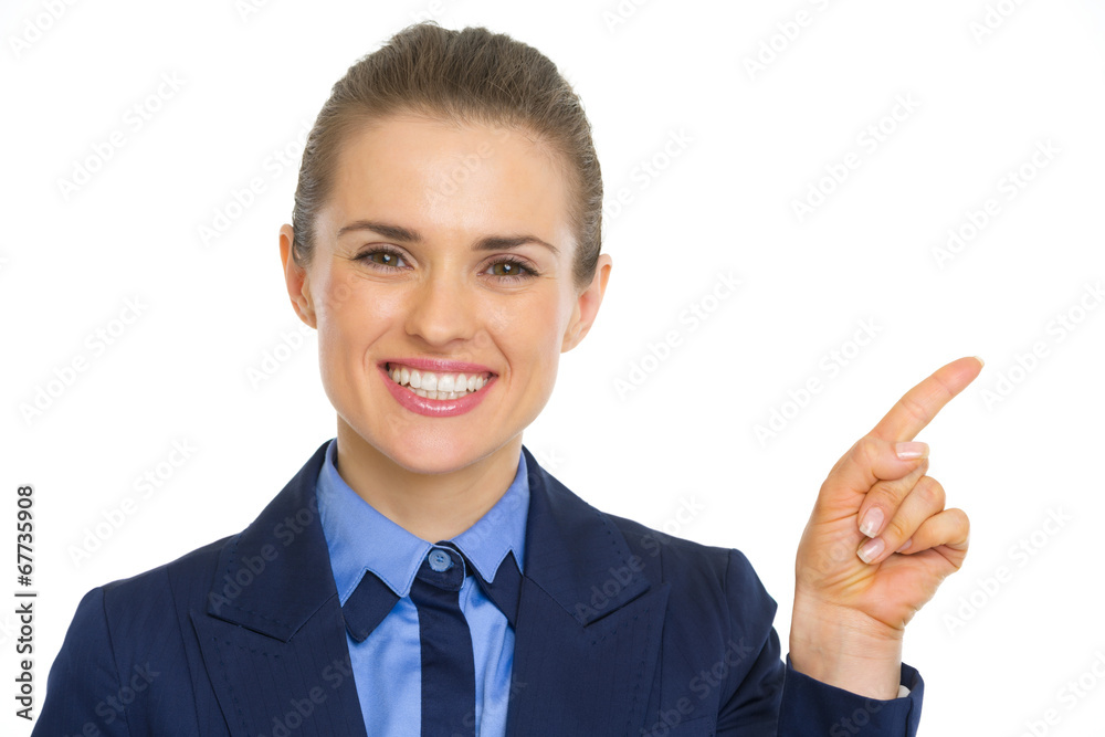 Portrait of smiling business woman pointing on copy space Portrait of smiling business woman pointing on copy space