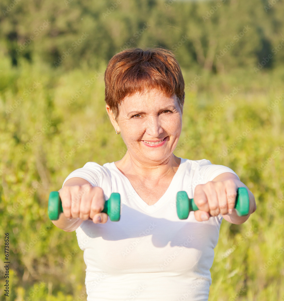 attractive woman 50 years doing fitness attractive woman 50 years doing fitness