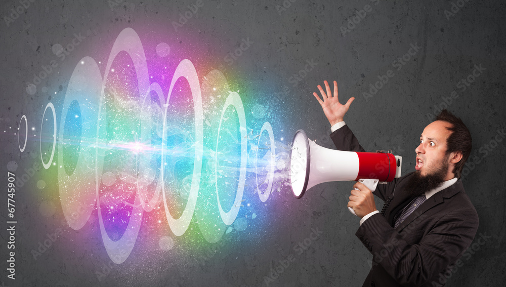 Man yells into a loudspeaker and colorful energy beam comes out Man yells into a loudspeaker and colorful energy beam comes out